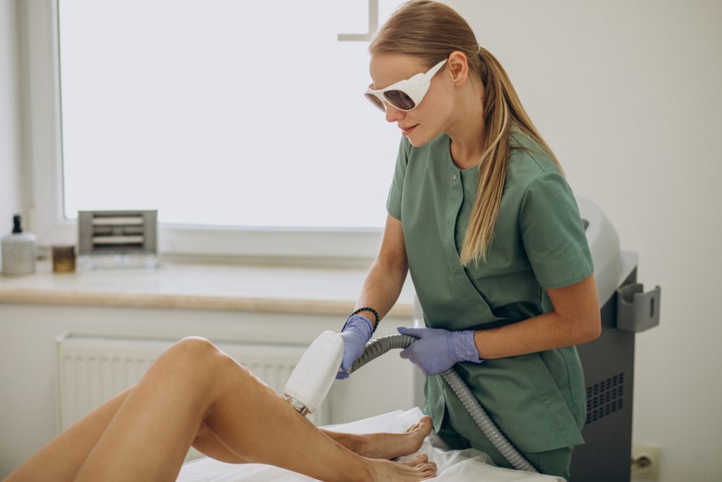 advanced laser hair removal machine treating legs in Dubai clinic