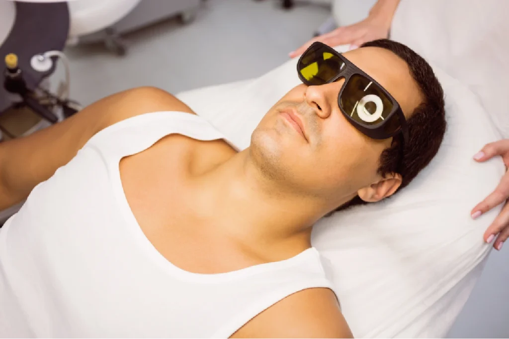 patient with protective glasses waiting to get laser treatment