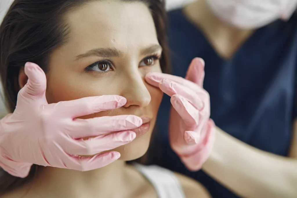 woman at a cosmetic clinic with the doctor for skin treatment