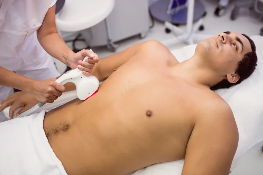 man at a clinic getting laser hair removal treatment