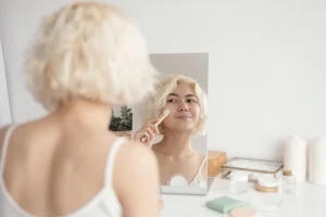 woman doing anti-aging skin routine at home